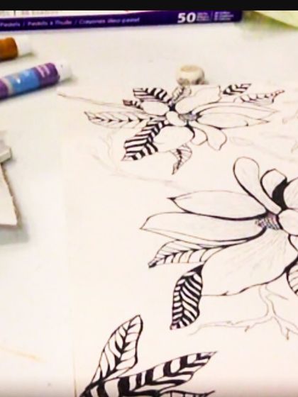 A pen and ink floral drawing in progress, showcasing the beauty of clean lines and patterns.