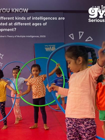 Did you know there are multiple kinds of intelligences? Here, kids playing with hula hoops are developing bodily-kinesthetic and interpersonal intelligence, all part of my holistic approach.