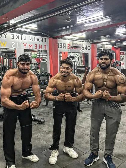 Posing with my clients, showing the results of our collective hard work. As a coach, their success is my success.