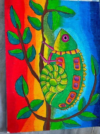 A close-up of a whimsical chameleon drawing, filled with vibrant colours and patterns. This piece is a great example of how we encourage imagination and detailed work.
