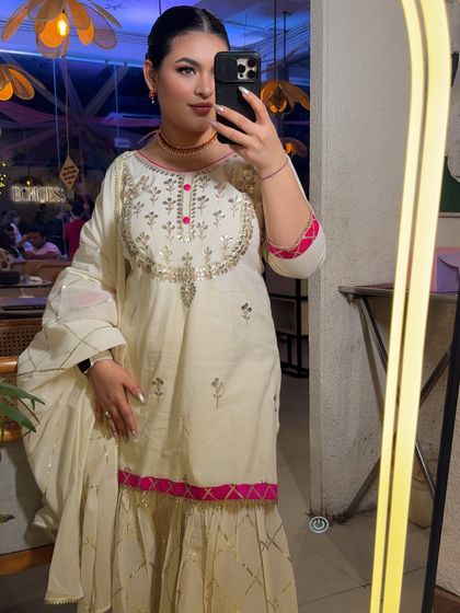 A mirror selfie showing my full outfit and makeup for a sangeet night.