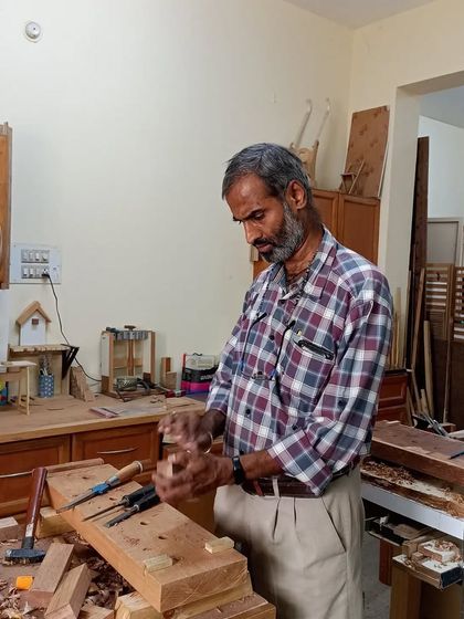 Mohan learning the art of wood carving with a chisel. My hand tools workshop focuses on these foundational skills, teaching you how to shape wood with precision and control.