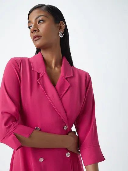 A sleek and modern look for a Westside blazer dress. The makeup is clean with a defined lip, and the hair is pulled back to create a sharp, professional silhouette.