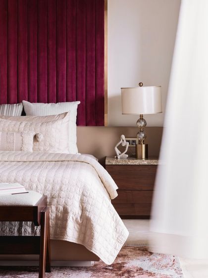 Another artistic shot of the master bedroom, focusing on the elegant details and luxurious materials.