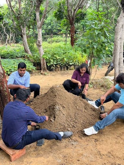 New employees from Valvoline Cummins get hands-on, filling recycled bags with a nutrient-rich soil mix to nurture future saplings.