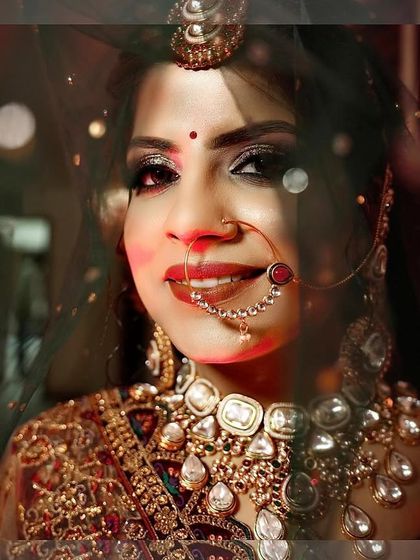 A close-up bridal portrait with a beautiful bokeh effect from background lights, creating a magical and dreamy atmosphere.