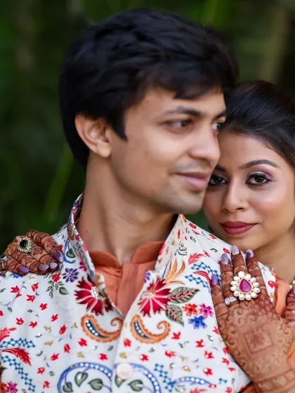 A beautiful couple shot. The client's makeup is soft yet defined, with a focus on her expressive eyes.