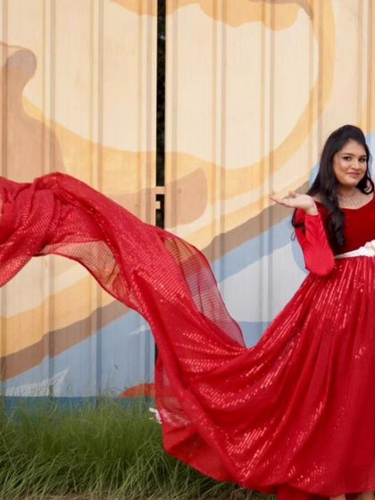 This red velvet and sequin maternity gown is all about glamour. The long, sparkling trail catches the light beautifully, creating a stunning visual for your photos.