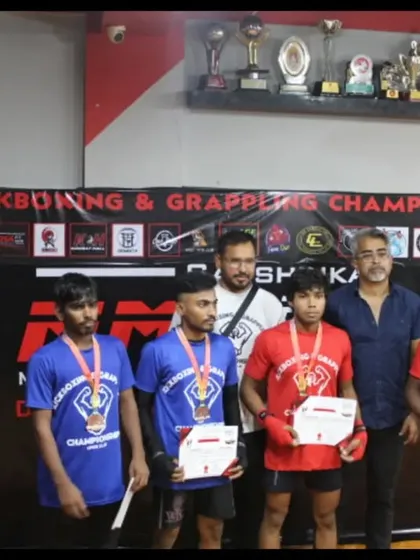 Our grappling champions from the MFC Series 2, showcasing their medals and cash prizes.