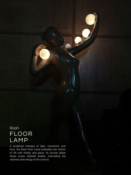 The Rooh Floor Lamp is a sculptural interplay of light, movement, and form. The figure embodies the rhythms of life with grace, while its circular glass lamps evoke celestial bodies, channeling the vastness and energy of the cosmos.