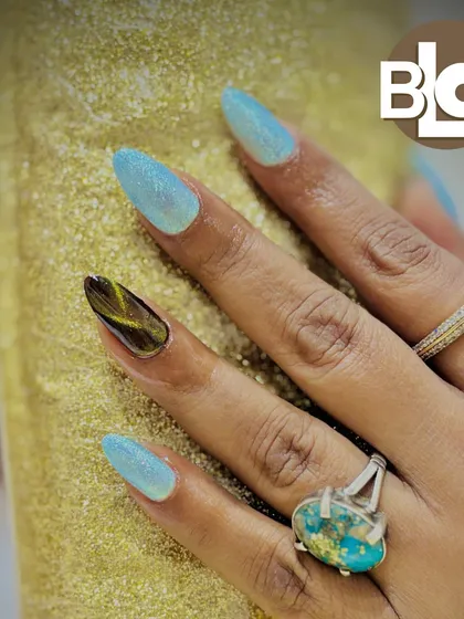 I love creating unique accent nails. Here, I paired a shimmery, light blue polish with a custom, hand-painted tortoiseshell design on the ring finger for a truly one-of-a-kind manicure.