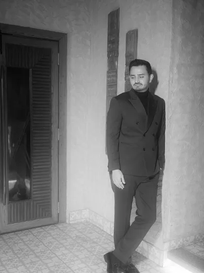 A moody, black and white portrait of the groom, Jay, during his cocktail party. I like to capture individual portraits that reflect the personality of each partner, adding another layer to the wedding story.