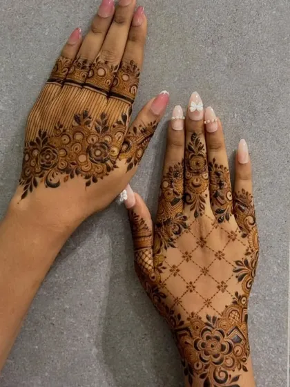 Here you can see two different but complementary styles. One hand has a modern jaal pattern, while the other has a more traditional floral design.