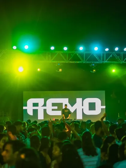 A wide shot of the massive stage and crowd at IIT Indore. My logo on the screen establishes a strong stage presence.