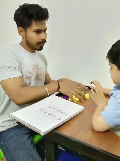 In this special education session, we are working on pre writing skills using play dough. This helps build hand strength and cognitive skills needed for handwriting and letter formation.