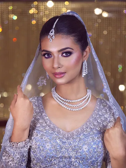 The glow-up for my 'happily ever after' has begun. This modern bridal look with purple smokey eyes and diamond jewelry is absolutely stunning.