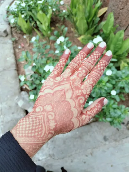 This is the beautiful, rich reddish-brown stain that develops after the henna paste is removed. I only use 100% organic henna that I mix myself to ensure you get this gorgeous, natural, and safe result every time.