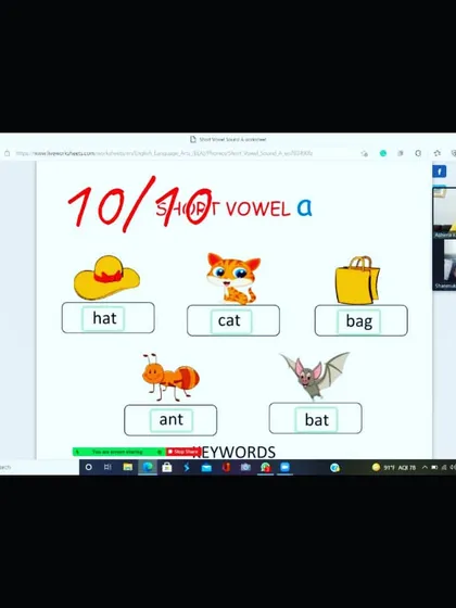 A screenshot from a live class where we worked on the short vowel 'a' sound. The student is identifying and reading CVC (consonant-vowel-consonant) words like 'hat', 'cat', and 'bat' from a colorful worksheet.