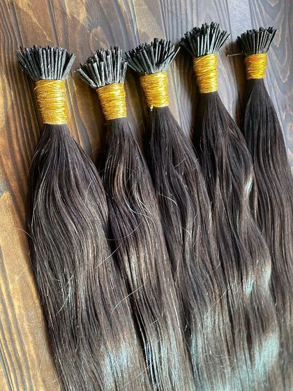 A collection of I-Tip extensions in various shades, ready for wholesale orders. Each bundle is made from 100% high-quality human hair.