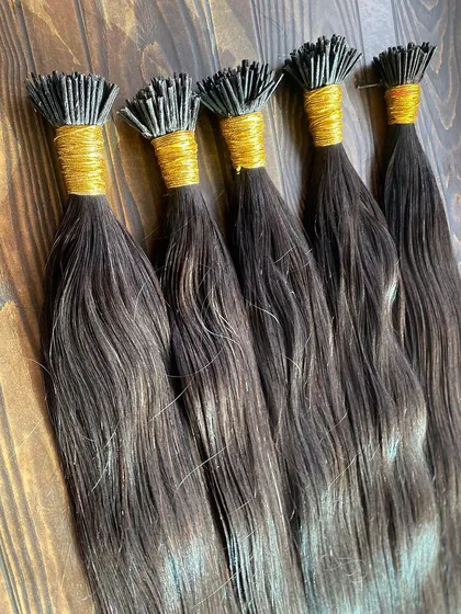 A collection of I-Tip extensions in various shades, ready for wholesale orders. Each bundle is made from 100% high-quality human hair.