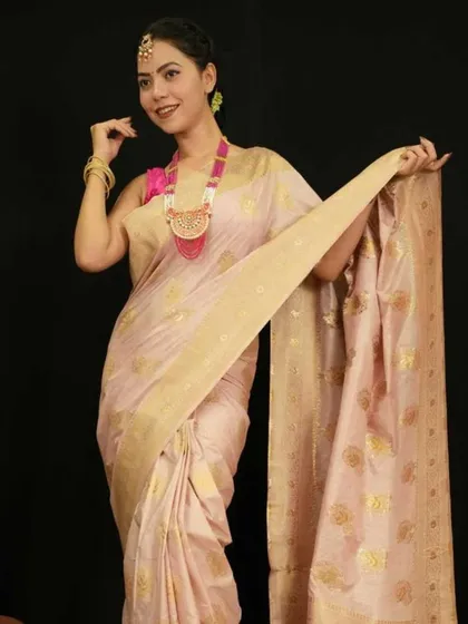 This light pink Banarasi 1-minute saree exudes grace and elegance. The soft color and golden buti work make it a wonderful choice for daytime functions or evening parties.