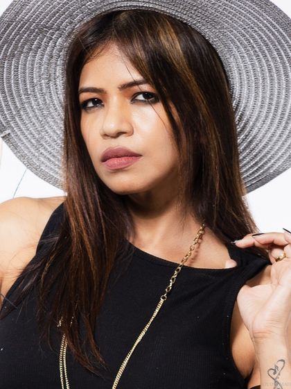 A close-up beauty shot, focusing on the model's expression.