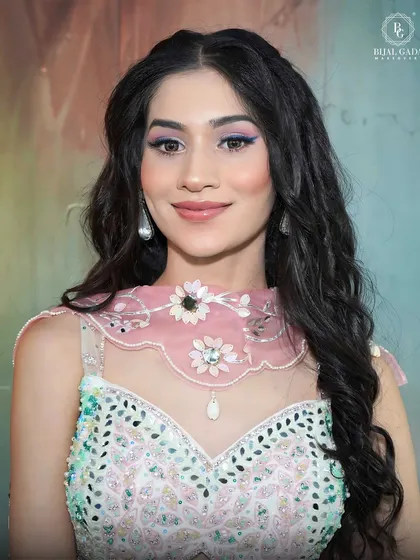 Another close-up of the pastel look, this time with a focus on the radiant skin and the subtle pop of color on the eyes. It’s a perfect example of modern, understated glam.