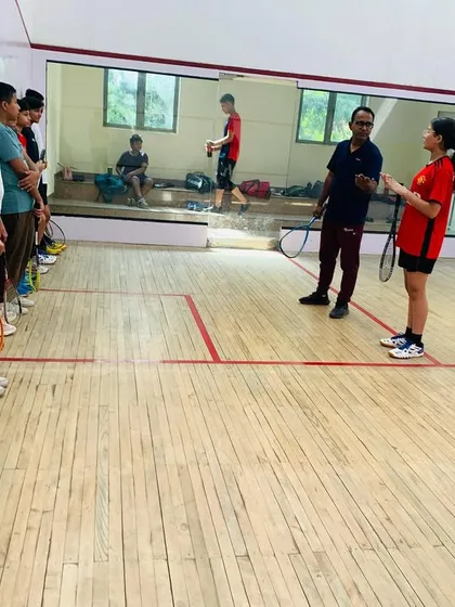 We focus on teaching the fundamentals correctly from day one. Here, our junior players are learning the proper grip and stance, essential building blocks for a solid squash technique.