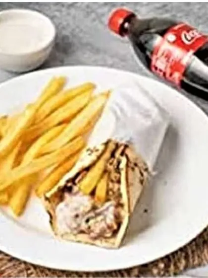 Another view of the classic shawarma combo, showing the roll, fries, and drink plated together. This is one of my best-value deals for a filling meal.