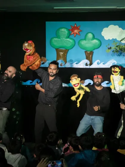 The talented puppeteers of 'The Monkey & The Crocodile' take a bow with their creations. This performance brings a classic Panchatantra folktale to life with colorful hand puppets and a valuable moral lesson.