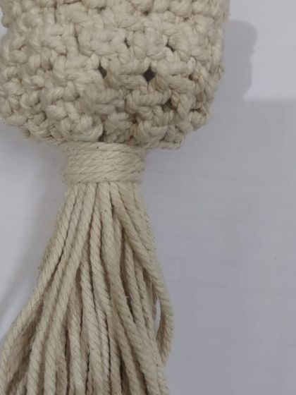 A student's work in a classic, natural off-white cord. This mini plant hanger looks so elegant.