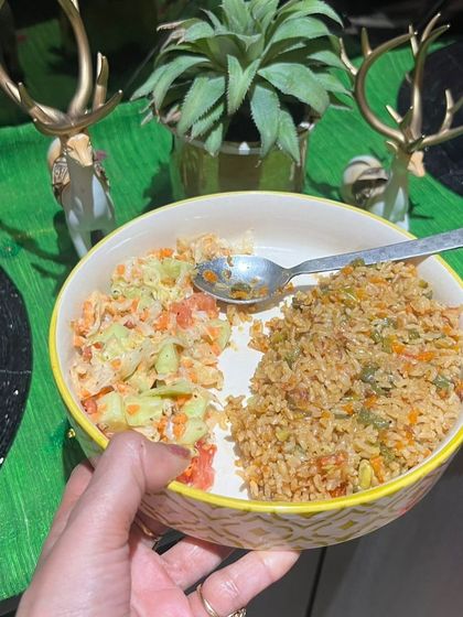 A satisfying bowl of vegetable pulao with a side of creamy raita. This meal was part of a plan that helped a client lose nearly 3 kgs in under two weeks.