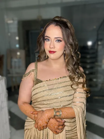 Another view of this classic party look. The combination of red lips and soft glam eyes is always a winning choice for any celebration.