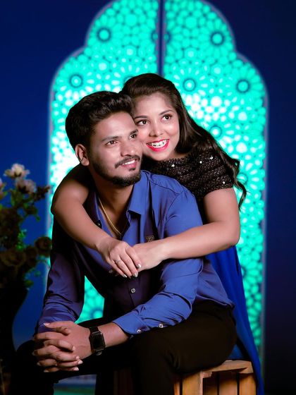 A happy and relaxed studio shot. Their simple blue and black outfits are perfect for a classic portrait.