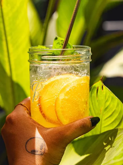 Another shot of our orange and mint soda, held up to the sun.