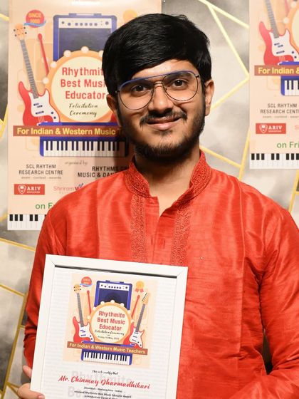 Mr. Chinmay Dharmadhikari, recognized with the Rhythmite Best Music Educator Award for his excellence in teaching Hindustani Classical Singing.