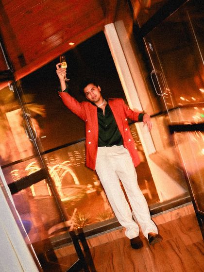 The full party ensemble. The bold color combination and confident styling show how our bespoke service can bring any client's vision for a special occasion to life.