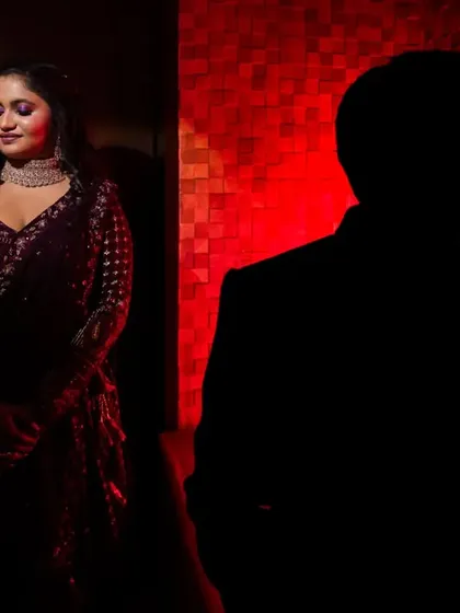 Using shadow and a single source of red light to create a dramatic and mysterious portrait. This is for couples who want something bold and different.