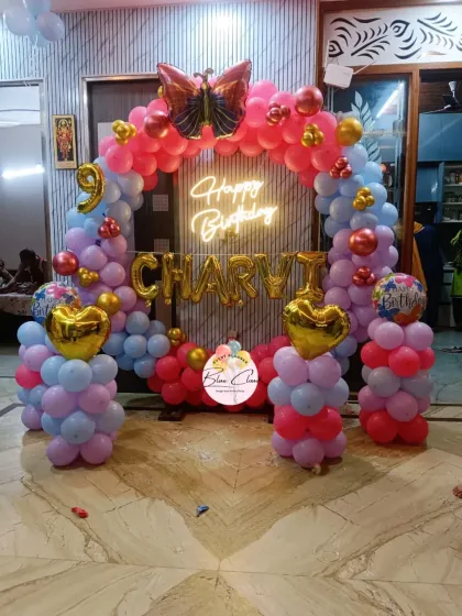 Another angle of the colorful 9th birthday balloon arch, showing the full setup.