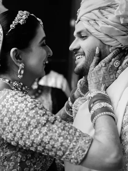 The same moment of joy, captured in timeless black and white. Monochrome photos often highlight the raw emotion, stripping away distractions and focusing purely on the connection.