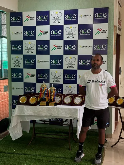 Standing with the trophies before the award ceremony at the Ace Tennis Academy tournament in Ahmedabad.