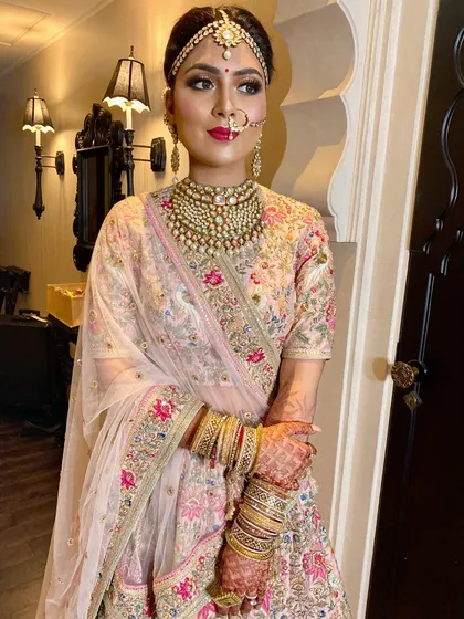 A close-up of this Sabyasachi bride's look. The dramatic kohl-rimmed eyes are balanced with a soft pink lip and a flawless skin finish for ultimate bridal allure.