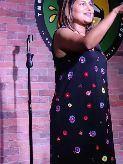 A shot of me mid-performance in Singapore. I love the energy of international audiences and the challenge of making people from different backgrounds laugh together.