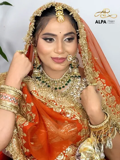 This pose highlights the intricate nath (nose ring) and the perfectly matched lip color.