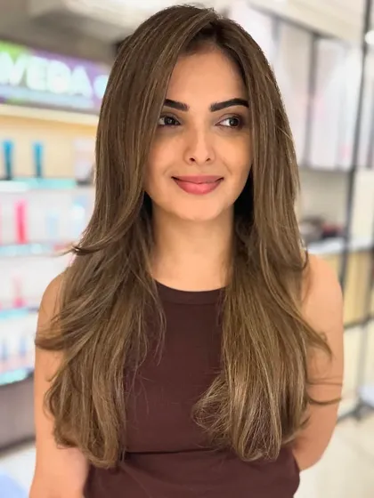 Face-framing baby lights are a perfect way to brighten your look. This technique adds subtle, sun-kissed highlights around the face for a natural glow.