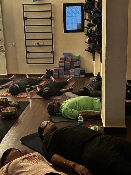 Students resting in Yog Nidra, a state of conscious deep sleep, during a sound bath. The eye pillows help to quiet the mind, allowing for a deeper meditative experience.