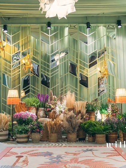 The photo-op area at 'The Conservatory' baby shower, beautifully lit for evening photos.