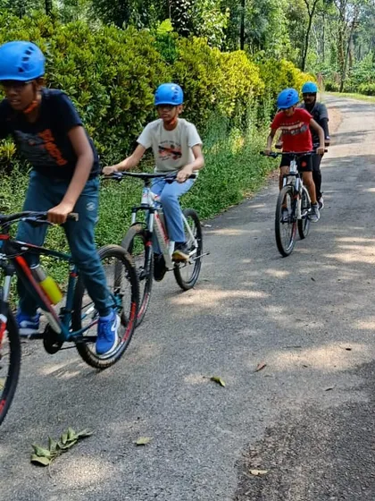 Young adventurers take on the winding trails through Coorg's coffee estates on our mountain biking expedition. This activity is a highlight of our Barapole camp, combining physical challenge with the beauty of the Western Ghats.