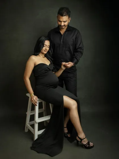 A tender moment in the studio. The way you hold hands and look at each other shows the deep connection you share, captured in a classic and elegant setting.