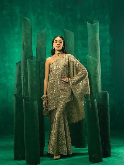 A front-facing view of the golden embellished cape set from 29 India.